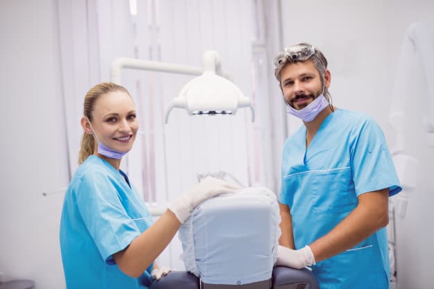 dentists-smiling-posing-dental-clinic_107420-65533